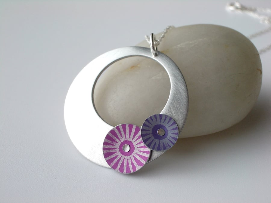 Circle pendant necklace in brushed aluminium with pink and purple discs