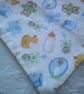 Babies Dribble Bib with Bottles, Bibs and Bootees in Blue on a Cream Background - Image 4