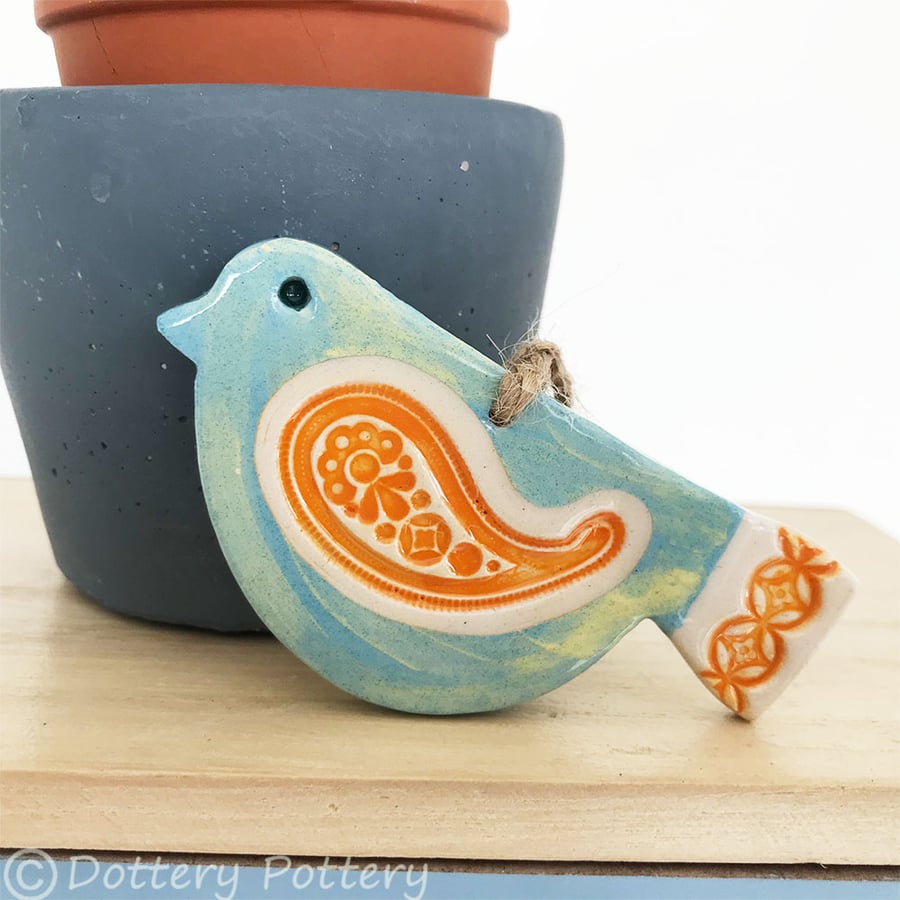 Ceramic bird decoration with patterned wing and tail 