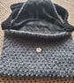 Hand knitted shoulder bag. Grey and black