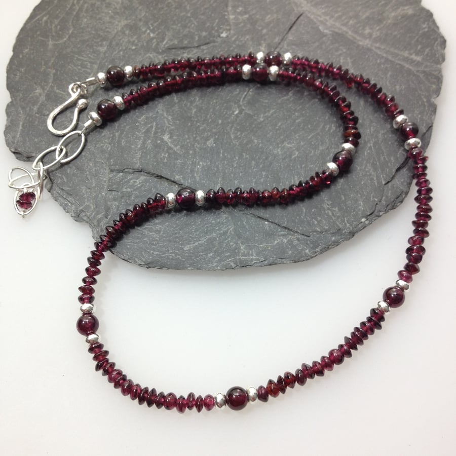 silver and garnet bead necklace.