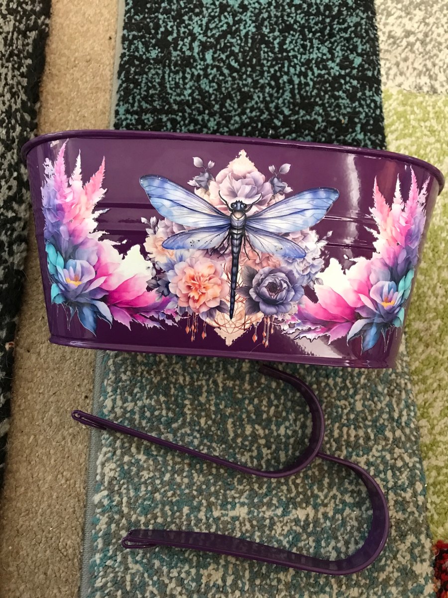 Purple fence planter with dragonfly motif