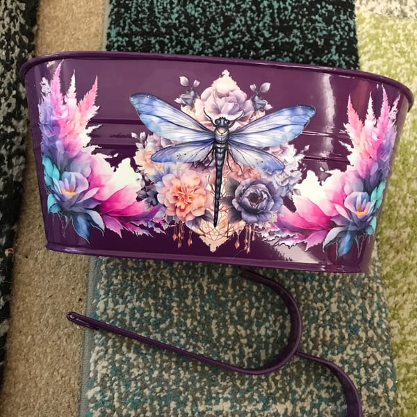 Purple fence planter with dragonfly motif