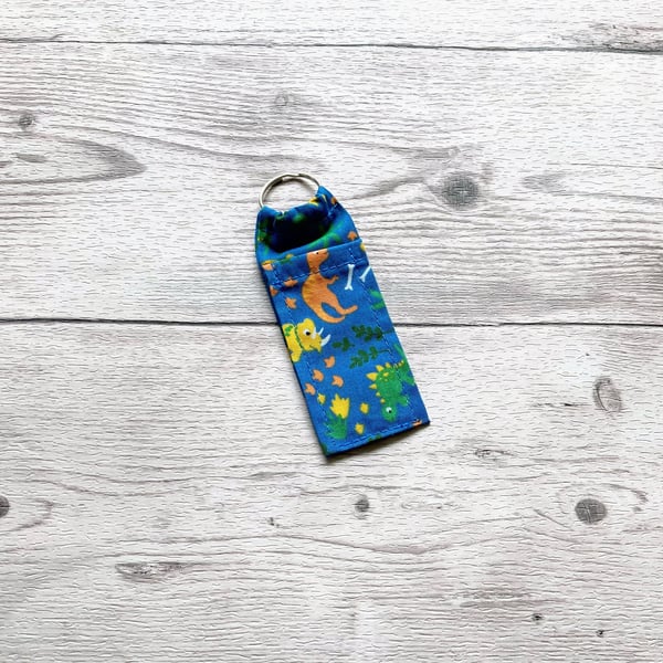 Dinosaurs lip balm blue polycotton fabric keyring. 
