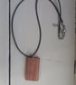 Handmade wooden pendant is crafted from reclaimed teak