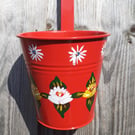 Round hanging planter handpainted with canal art style roses and daisies