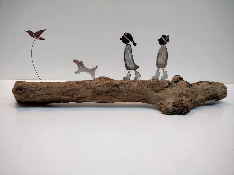 Couple walking, dog and bird