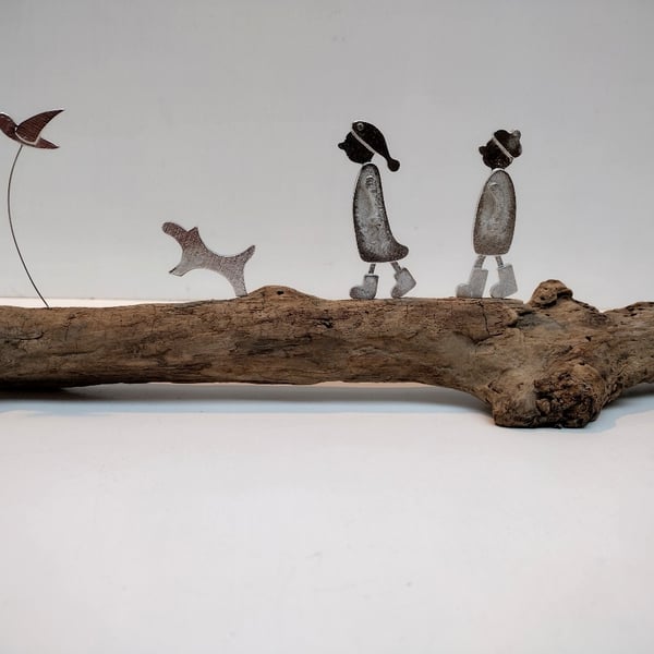 Couple walking, dog and bird