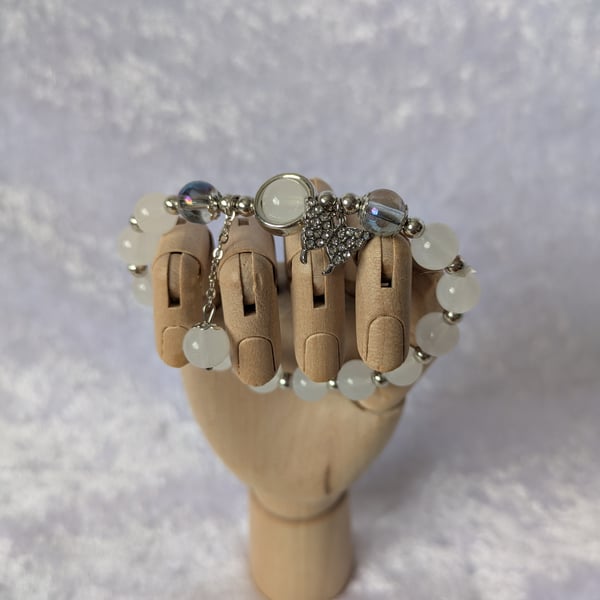 White clouded bead bracelet with butterfly charm