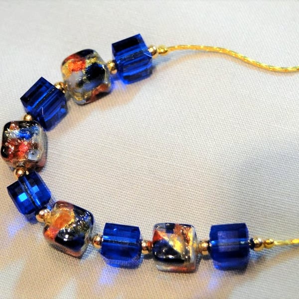 A Crystal Necklace with Swarovski Blue cubes and Murano blue and gold cubes