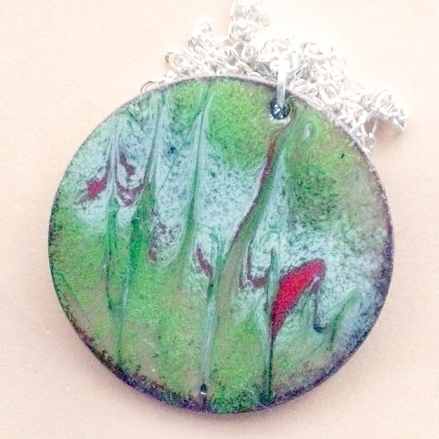 enamel pendant - round, scrolled white and red over green