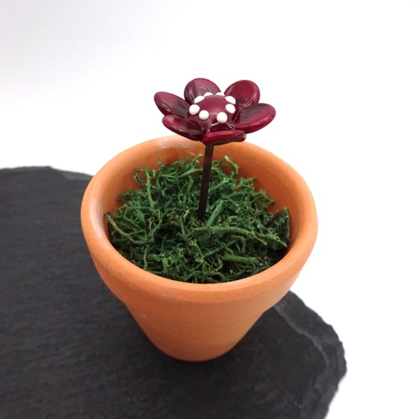 dark red glass flower in pot