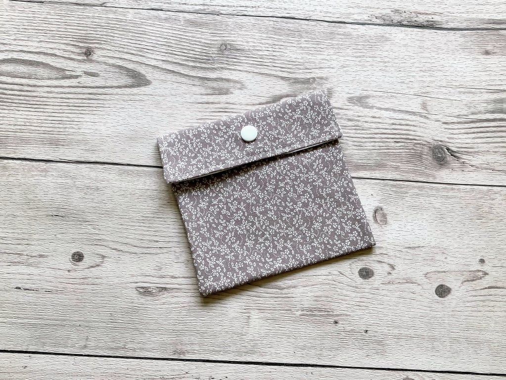 Discreet sanitary pouch. Feminine products holder. Ditsy floral grey.