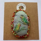 Handmade and hand painted fabric pin brooch with love bird design 
