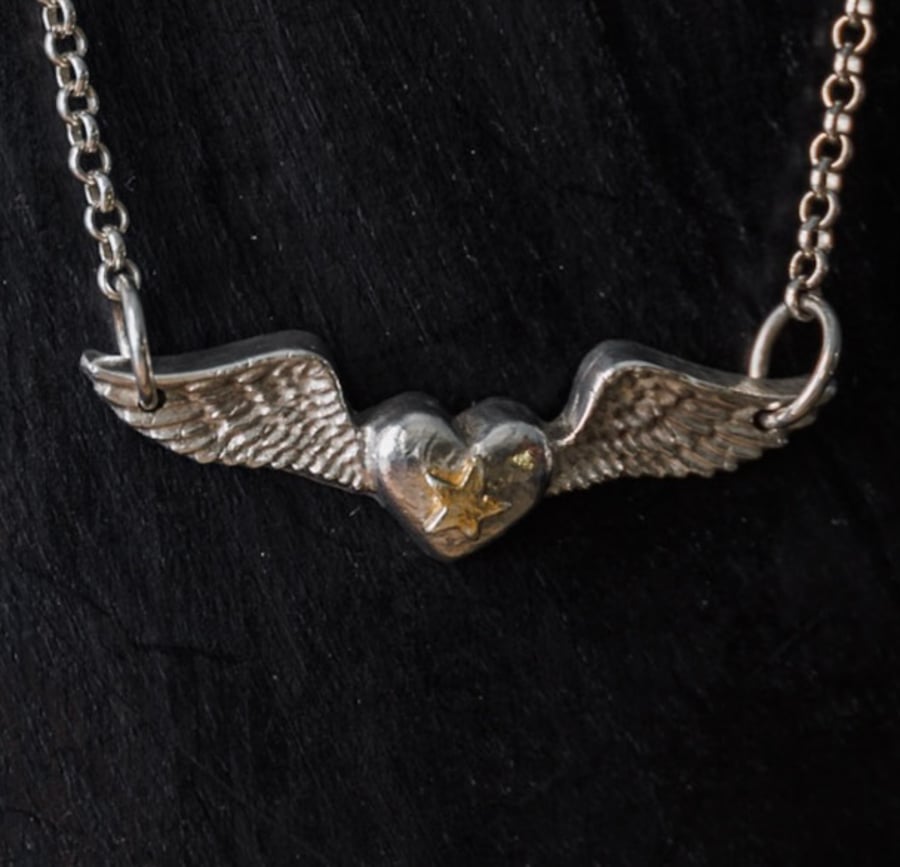 Angel wings heart pendant with gold star