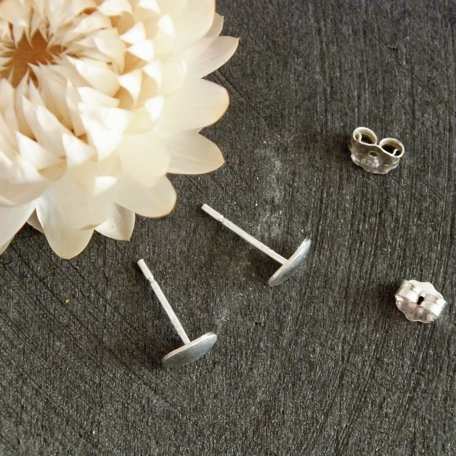 Polished sterling silver oval stud earrings; minimal everyday studs