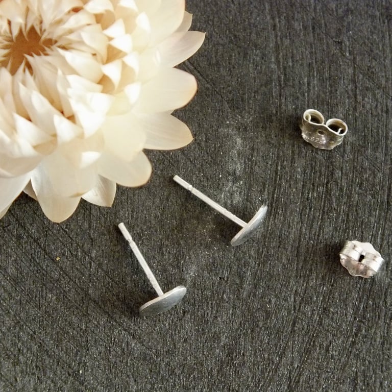 Polished sterling silver oval stud earrings; minimal everyday studs