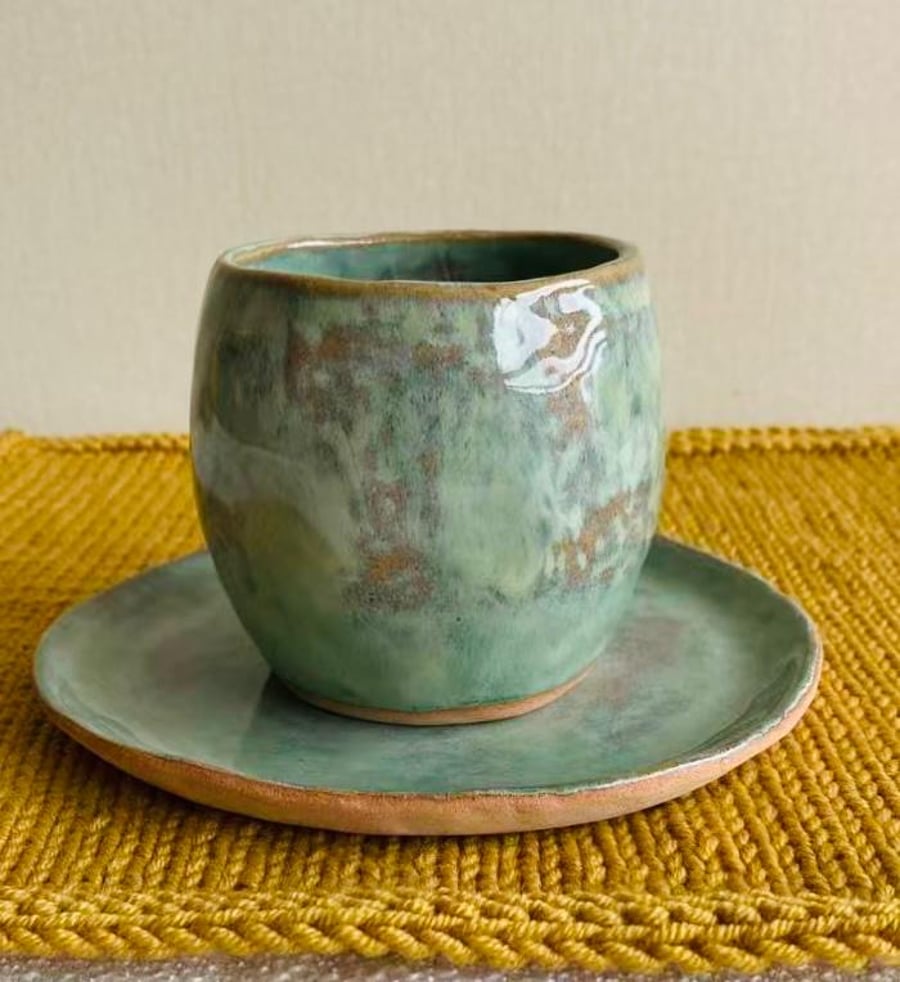Hand pinched tea cup and saucer in Olive Green