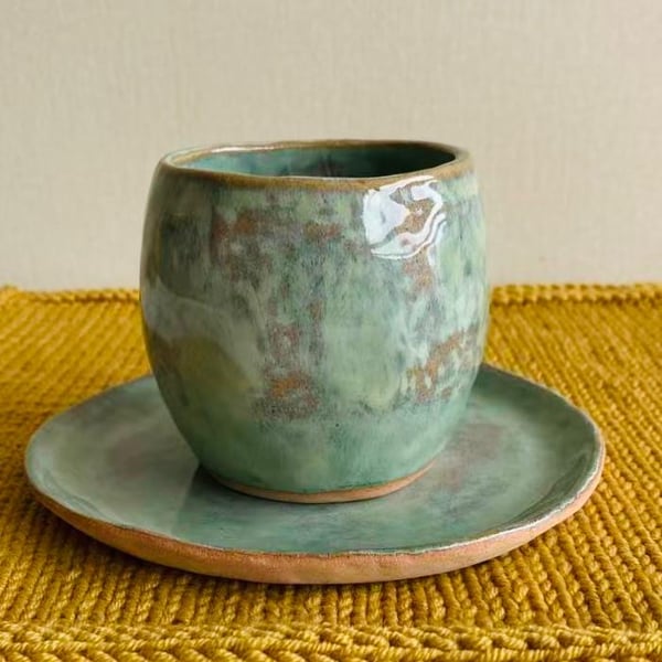 Hand pinched tea cup and saucer in Olive Green