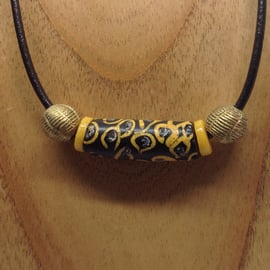 A unisex cord necklace with giant old African trade bead 