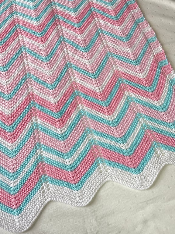 Pink white and turquoise, hand knitted baby blanket.