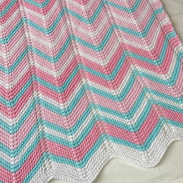 Pink white and turquoise, hand knitted baby blanket.