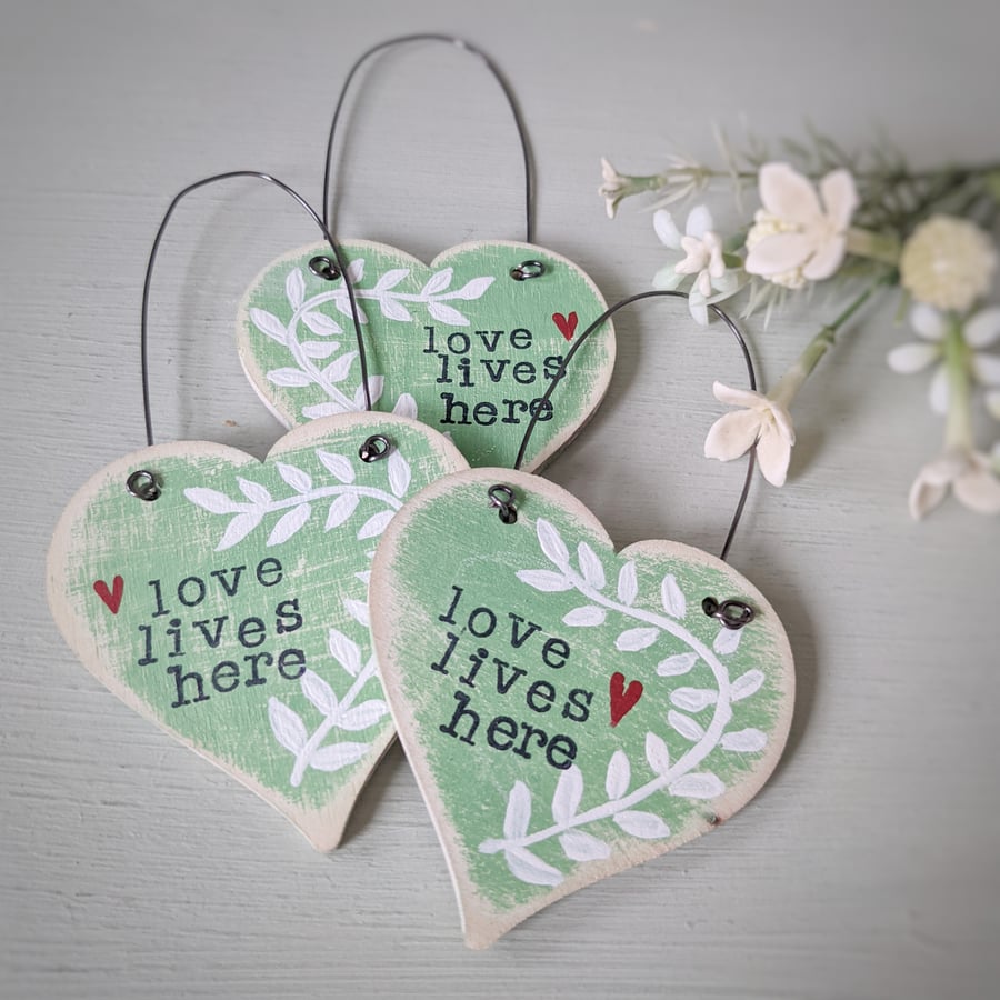 Hand Painted Wooden Heart Hanging Decoration 'Love Lives Here'
