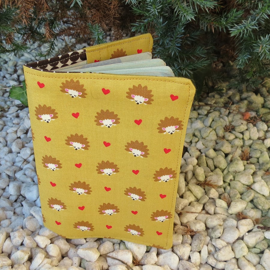 Hedgehogs.  A passport cover with a hedgehogs design.  Passport sleeve.