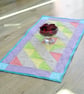 Handmade Quilted table runner with pale spring fabrics and scattered stars. - Image 1
