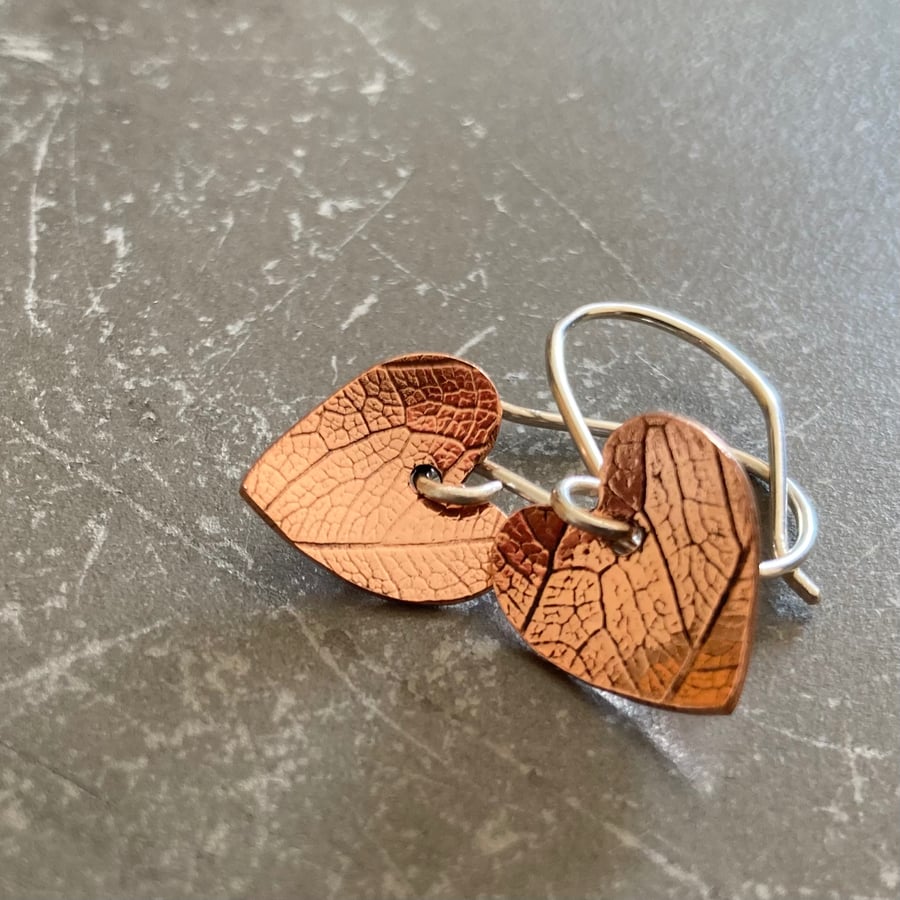 Leaf textured copper heart earrings