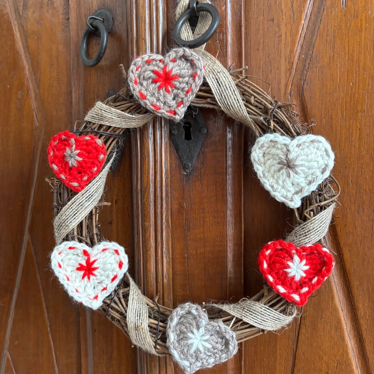 Scandi-style Christmas wreath made from crocheted hearts and ribbon