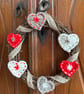 Scandi-style Christmas wreath made from crocheted hearts and ribbon