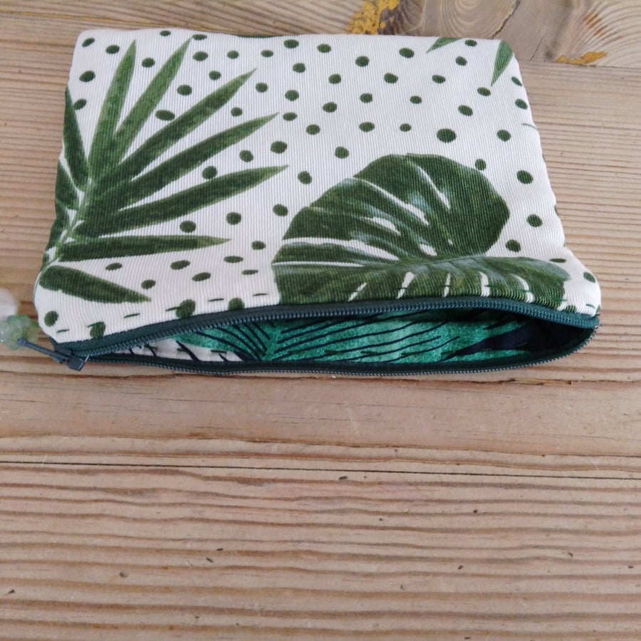 Make up bag fully lined with zipper closure.