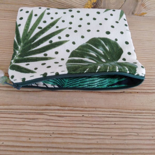 Make up bag fully lined with zipper closure.
