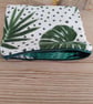 Make up bag fully lined with zipper closure.