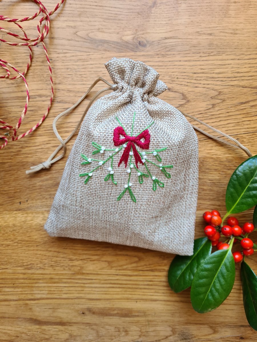 Christmas hand embroidered with a mistletoe design gift bags