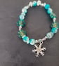 Elasticated winter beaded bracelet with crystal chip and snowflake charm - Image 4