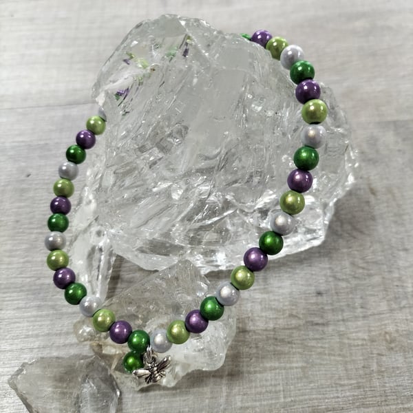 AL138C  Purple, greens and silver miracle bead elasticated anklet with bee,11.5"