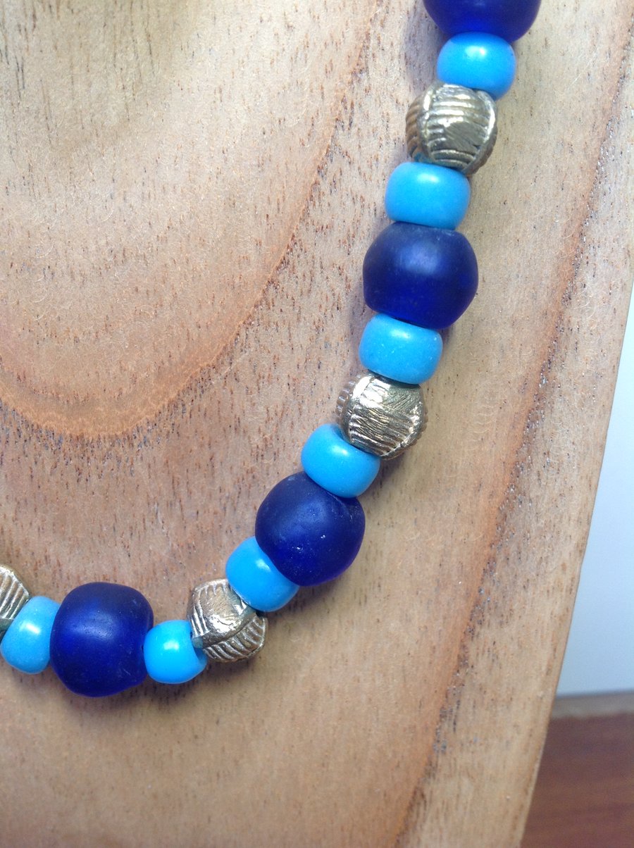 Blue and turquoise glass beaded necklace with chunky African brass beads