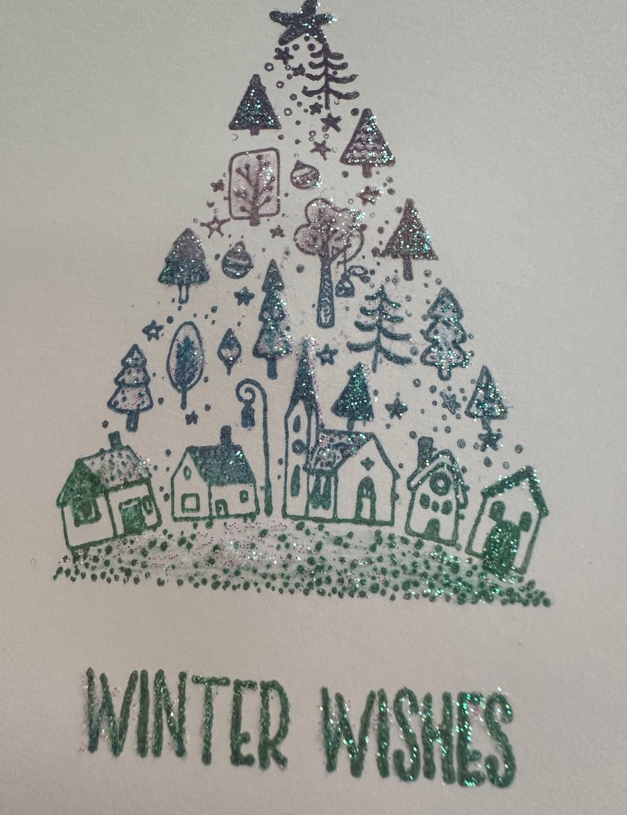 Pack of 4 glittery christmas tree village cards in subtle pastel colours 