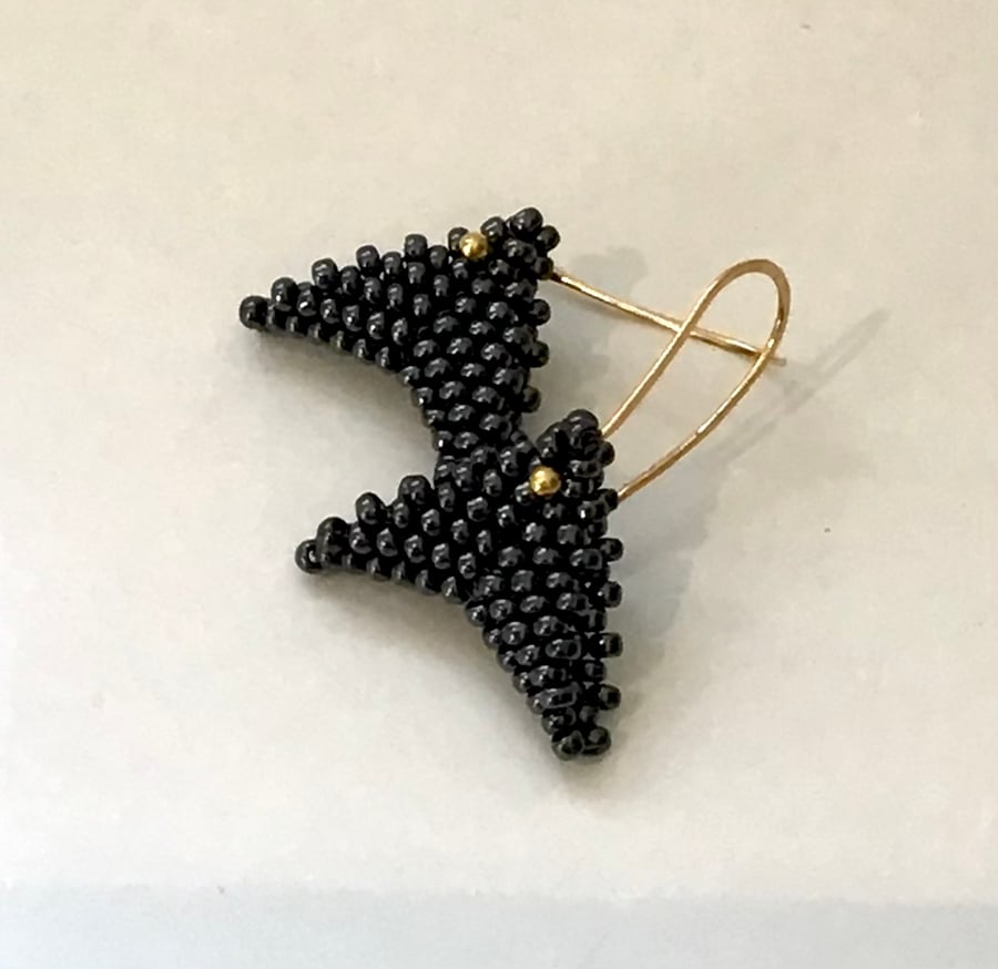 Black beaded arrowhead earrings