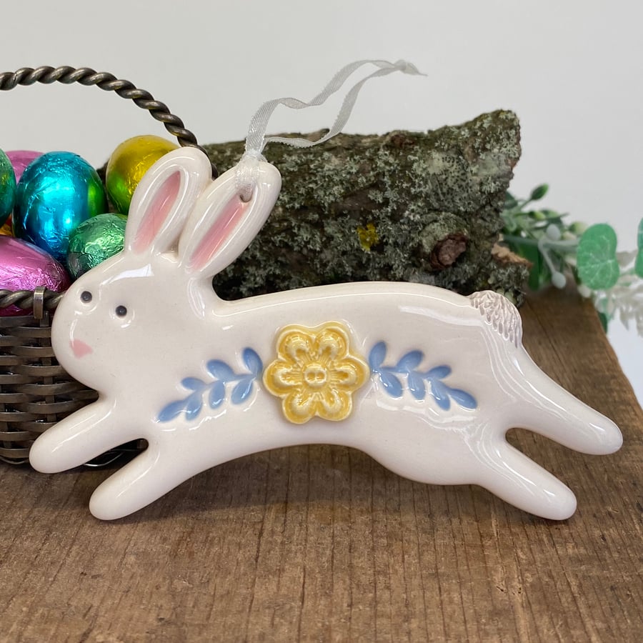 Ceramic Leaping Easter Bunny decoration yellow flower