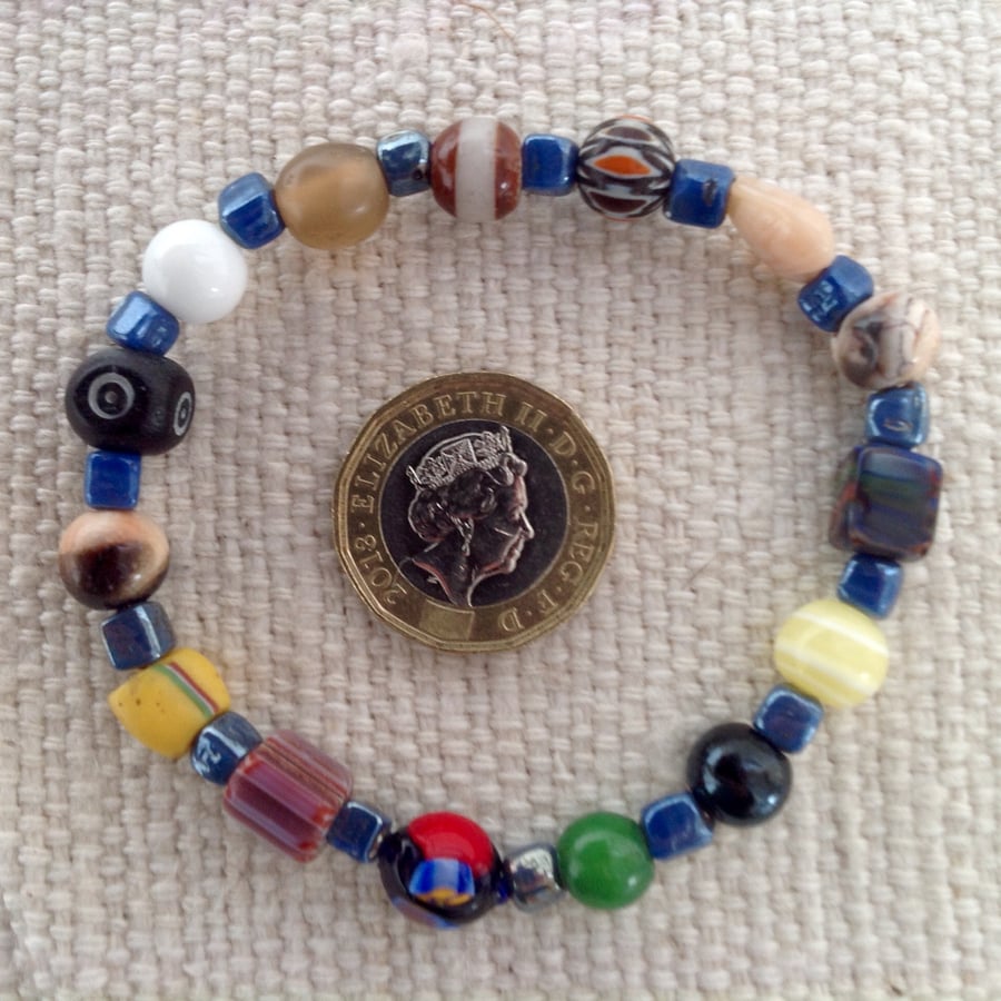 Bead collectors bracelet with blue lustre beads