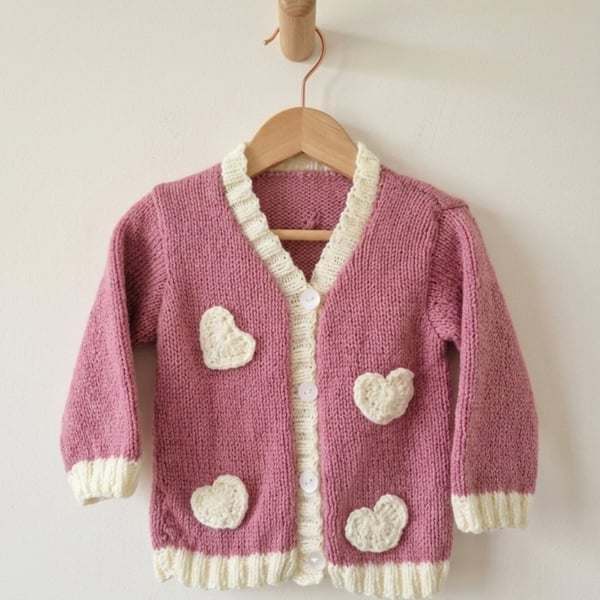 Hand-knitted girls cardigan, 12m to 2 years. Pink with ivory crochet hearts