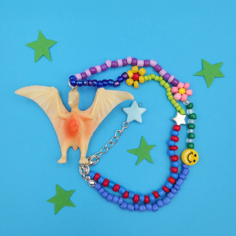 Chunky beaded necklace with up-cycled dinosaur charm 