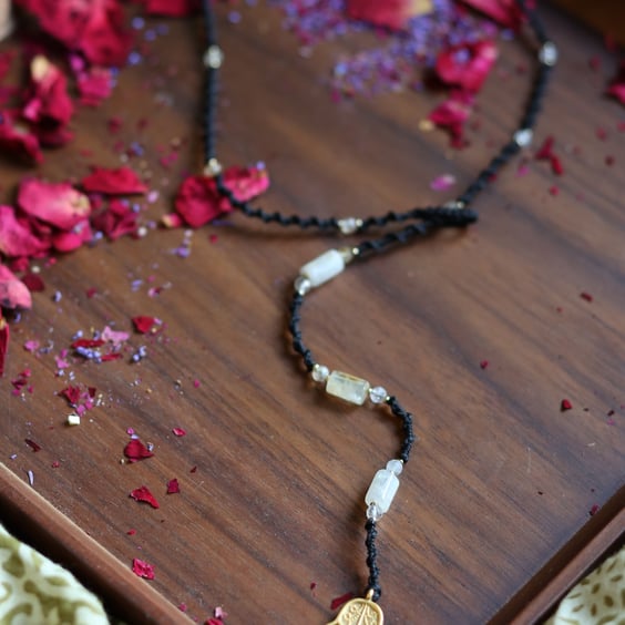 Macrame wrap necklace in black with Natural stone Citrine and brass Hansa hand 