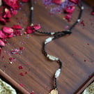 Macrame wrap necklace in black with Natural stone Citrine and brass Hansa hand 