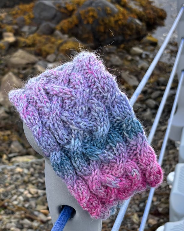 Hand knitted , lined, wool headband featuring Celtic knot pattern 