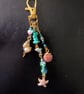 Gold nautical themed beaded bag charm 