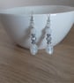 CRYSTAL, WHITE AND SILVER DANGLE EARRINGS. - Image 1
